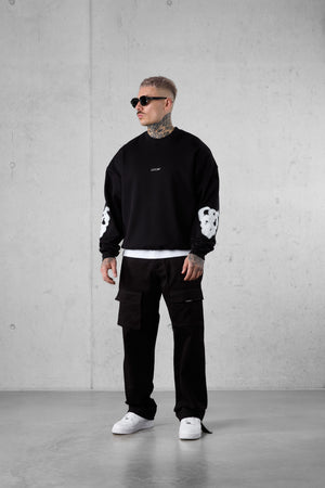 BLACK BLURRED HEARTS OVERSIZED SWEATER