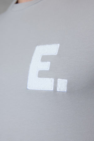GREY E. STATEMENT TEE